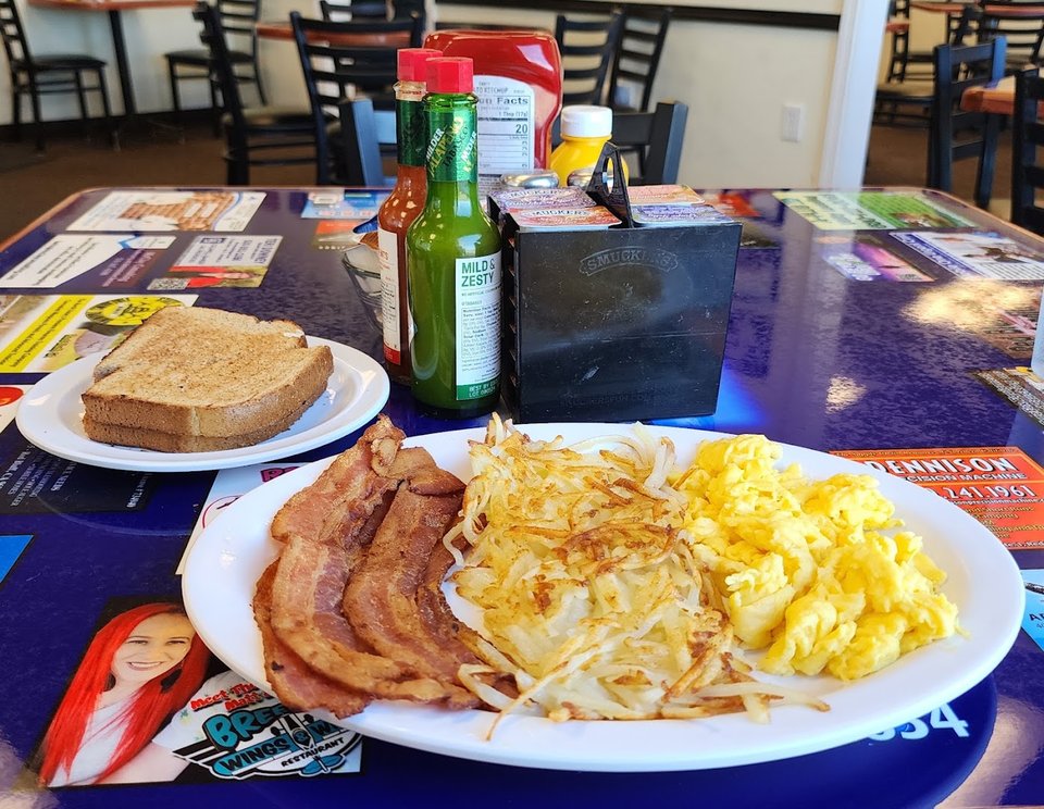Breakfast plates on a simple restaurant table.